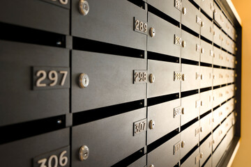 Mailboxes for letters and correspondence. Modern black mailboxes with numbers in the lobby of a...