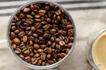 Coffee beans. Roasted coffee in a glass jar. Macro