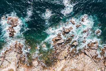 The rocky coast of France over the Atlantic Ocean, viewed from the drone. A beautiful sea landscape.
