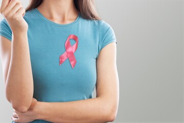 Breast Cancer Awareness month, Woman with Pink Ribbon for supporting people living and illness.