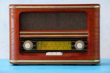 Retro radio receiver on light background