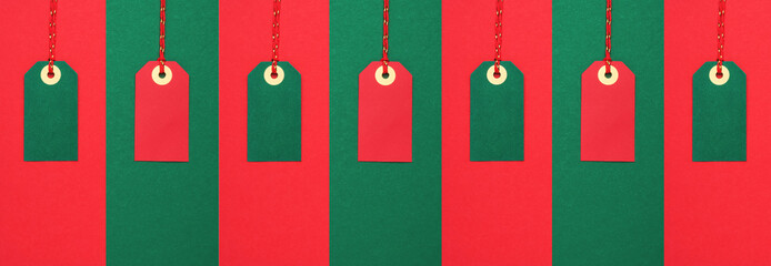Red and green sale tags. Discounts and Black Friday concept. Top view, copy space for text