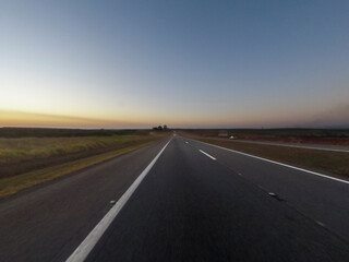 Obraz na płótnie Canvas Sunset in a brazilian highway