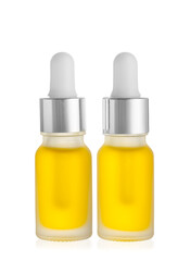 Bottles of essential oil on white background