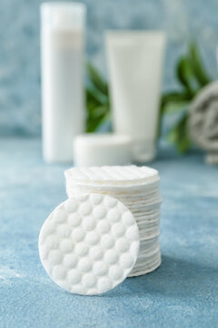 Stack of new clean cotton pads on table