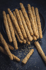 Breadsticks grissini. Bread sticks with sesame seeds.