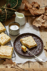 Apple pie slices with meringue served with coffee. Rustic style.