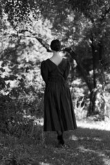 Naklejka premium Woman in dress from the back