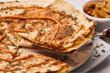 Quesadilla with meat and pink sauce