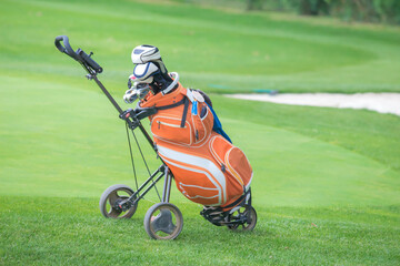Golf bag and trundler close up