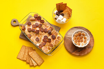 Composition with tasty S'mores dip on yellow background