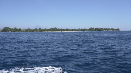 ocean waves sea island vegetation trees nature Gili Indonesia Bali travel navigate visit explore summer sunny day blue sky