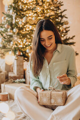 Woman opening her present on Christmas
