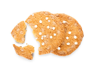 Broken tasty cookies with chocolate chips on white background