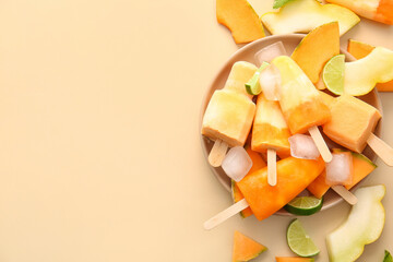 Plate with tasty melon popsicles on color background