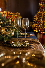 Empty glasses close up. Beautiful table setting with Christmas decorations in living room