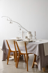 Elegant Christmas table setting on light background