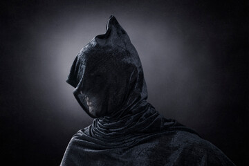 Creepy figure over dark misty background
