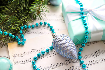 Christmas decor with beads on note sheets, closeup