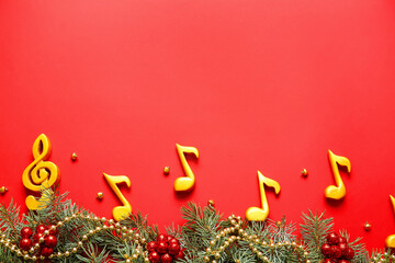 Note signs with Christmas decor and fir branches on red background