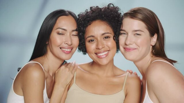 Beauty Portrait of Three Diverse Multiethnic Models on Isolated Background. Beautiful Happy Asian, Black and Caucasian Women with Natural, Healthy Skin. Wellness, Spa, Cosmetology, Skincare Concept.