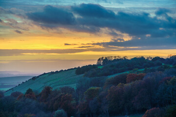 scenic Westerly view as the golden sun sets over Oare and across the Pewsey Vale valley, North...