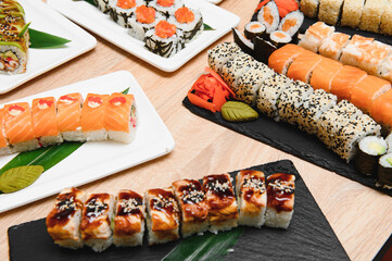 Japanese rolls on black background isolated with reflections