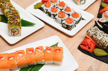 Japanese rolls on black background isolated with reflections