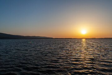 Wonderful sunset on the sea in Orbetello lagoon, Monte Argentario, Tuscany
