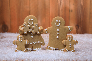 Family of Gingerbreads with 4 kids on Holiday Christmas Background