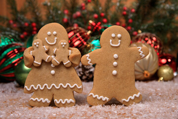 Family of Gingerbreads with 2 kids on Holiday Christmas Background