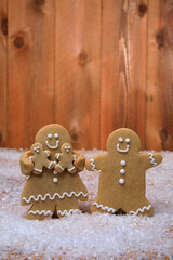 Family of Gingerbreads with 2 kids on Holiday Christmas Background