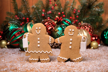 Family of Gingerbreads with kids on Holiday Christmas Background