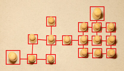 Chain of people figurines connected by white lines. Cooperation and interaction between people and...