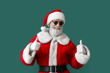 Cool Santa Claus showing thumb-up on color background