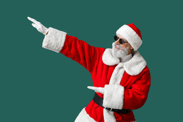 Fototapeta na wymiar Cool Santa Claus on color background