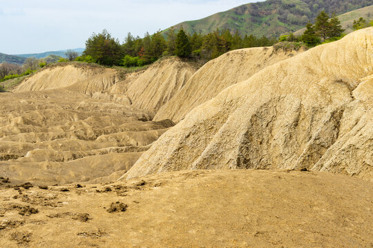Landscape photo of the soil without vegetation, rough and cracked in the area of ​​muddy volcanoes, Buzau, Romania, geological phenomenon that is unique in Europe