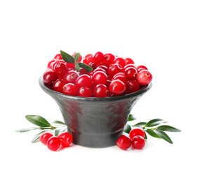 Bowl of ripe lingonberry on white background