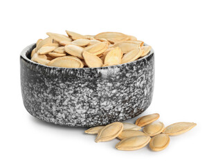 Bowl with natural pumpkin seeds on white background