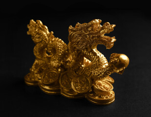 Fototapeta na wymiar Figurine of Chinese dragon on dark background