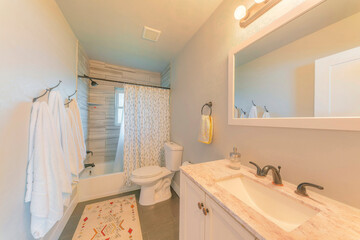 Bathroom interior with window and warm ambient lighting