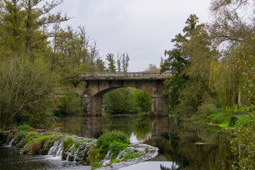 Roman bridge over river, Vilanova bridge, over the Arnoia river in Allariz, Ourense, Galicia, Spain