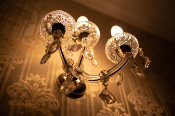 Expensive exquisite crystal chandelier in Victorian style indoor