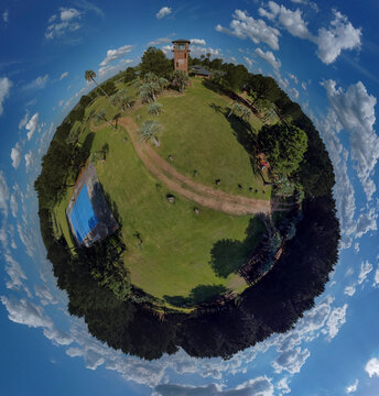Globe panorama. stereographic projection of green park and ciy view. 360 degree panorama. little planet