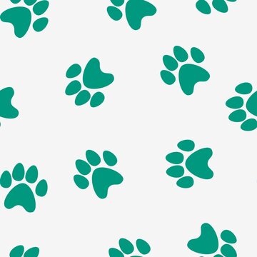 green footprints of a cat on a white background. seamless abstraction of animal footprints for clothing or print