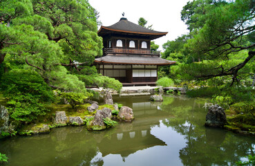 View of Higashiyama Jisho-ji temple among the amazing nature in front of a  pond in Kyoto, Japan