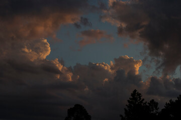 The sky with rain clouds and other colored clouds at the end of a day in the city of Apiaí, São Paulo, Brazil.