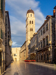 Early morning sun lights buildings in central street in Dubrovnik, Croatia.
