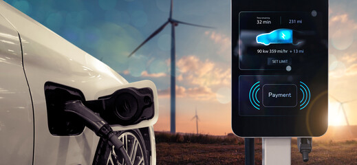 Electric car charging station charging power battery using pump cable, visual display landscape...