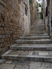 narrow passageway with stone steps in ancient city of Dubrovnik, Croatia